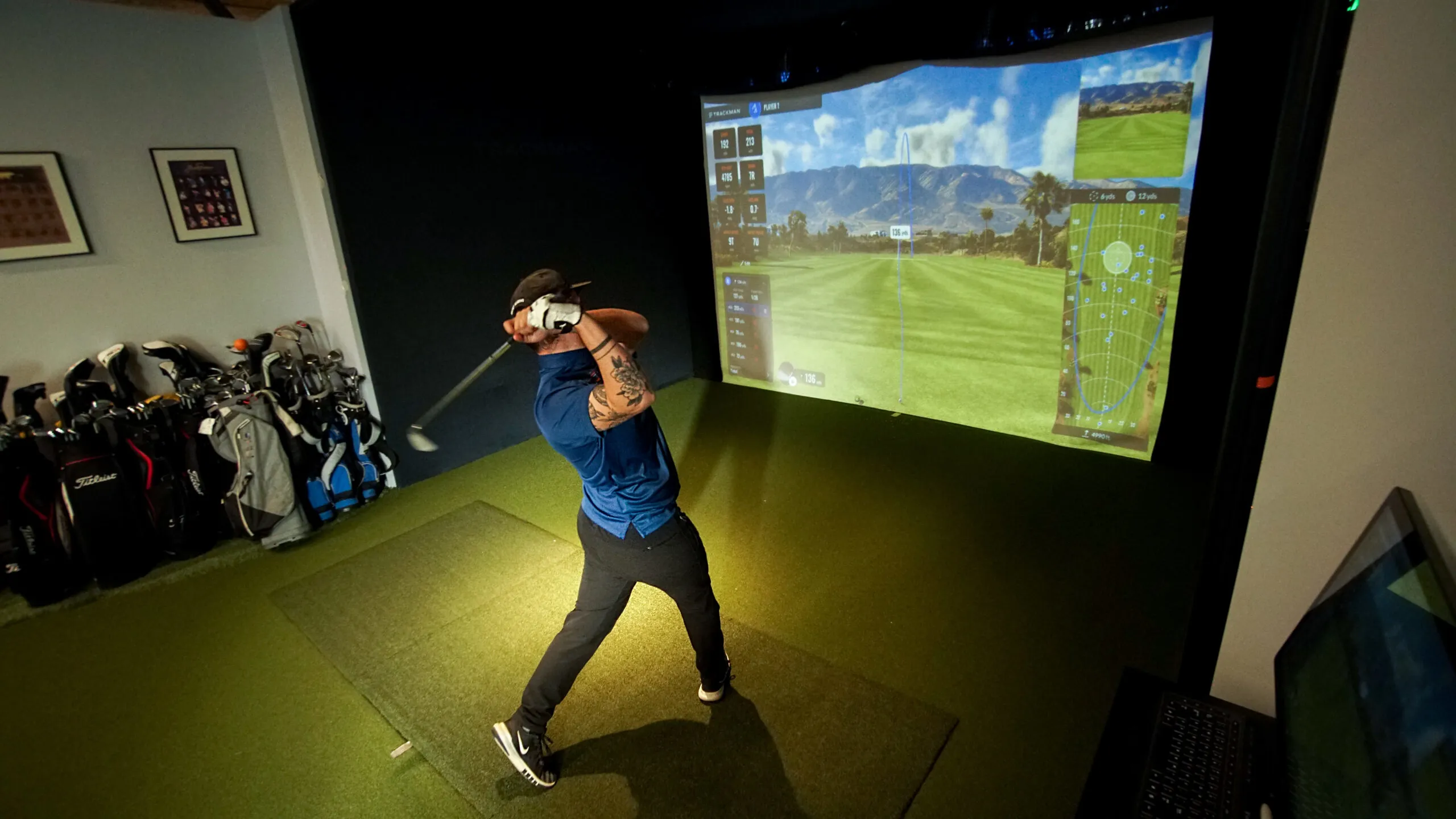 Indoor golf simulator with technology overlay
